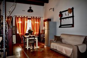 a living room with a couch and a table at Villa Manca in San Severino Lucano