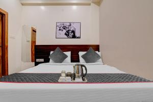 Townhouse Hotel O Benchmark客房内的一张或多张床位