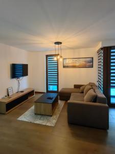 TV a/nebo společenská místnost v ubytování Borovi 3, apartman 3