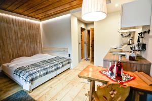 Posteľ alebo postele v izbe v ubytovaní Nosalove Apartamenty