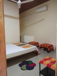 Katil atau katil-katil dalam bilik di Udesh Guest