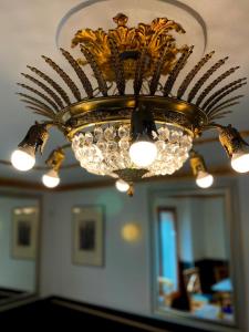 a chandelier hanging from a ceiling in a room at Hotel El Siglo in Valencia