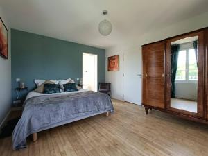 Postel nebo postele na pokoji v ubytování Le Haras d Havetot