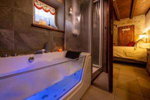 a bathroom with a tub with a laptop on it at Rifugio del Firenze Ninfa in Sestola