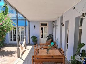 an outdoor patio with a wooden table and benches at La Soñada in La Paz