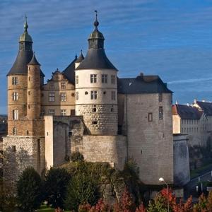 a large castle with two towers on top of it at Appartement-terrasse parking privé Meublé de Tourisme 4 étoiles in Belfort