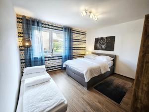 Postel nebo postele na pokoji v ubytování Schölerberg Appartement l ruhige Lage l nah an Zoo