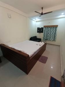 a bedroom with a large bed in a room at Sea Land Mandarmani in Mandarmoni