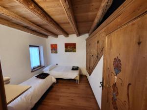 Postel nebo postele na pokoji v ubytování In Cima alla Contrada