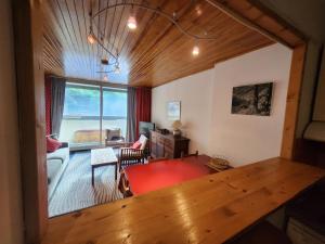 a living room with a view of a living room at Appartement 5mn des pistes in La Salle-les-Alpes