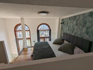 Posteľ alebo postele v izbe v ubytovaní mini loft Lido with own sunny & private garden