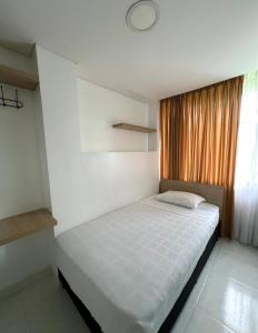 Katil atau katil-katil dalam bilik di Hotel Adel