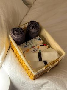 a basket with two cakes and tworets on a bed at Casa Choi 3 Bedroom Apartment in Seoul in Seoul