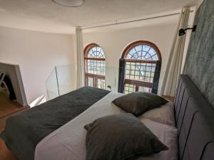 Posteľ alebo postele v izbe v ubytovaní mini loft Lido with own sunny & private garden