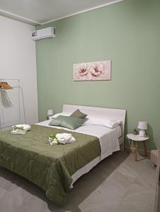 Postel nebo postele na pokoji v ubytování SiciliAmo b&b