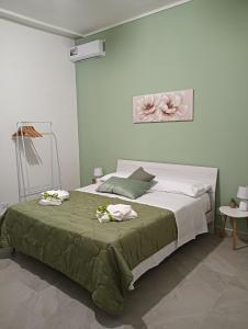 Postel nebo postele na pokoji v ubytování SiciliAmo b&b