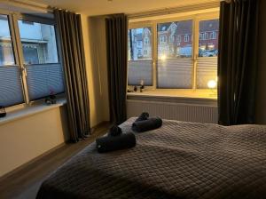 Giường trong phòng chung tại Ferienwohnung Schleswig Friedrichsberg Nähe von Schlei