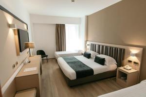 Postel nebo postele na pokoji v ubytování Grand Hotel la Chiusa di Chietri