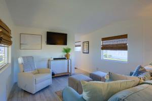 a living room with two couches and a tv at Waterfront - Private Dock and Boat Lift on Canal - Pets Allowed in Surf City +20 photos