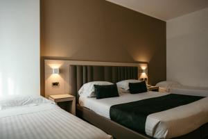 Postel nebo postele na pokoji v ubytování Grand Hotel la Chiusa di Chietri