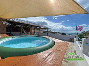 Het zwembad bij of vlak bij Palmeras Beach Apartments - Playa Santa