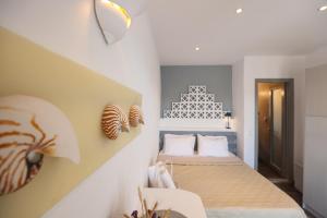 En eller flere senge i et værelse på Para Principe Tinos