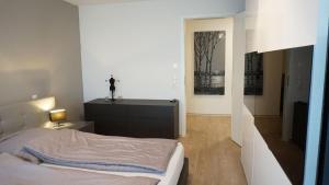 Postel nebo postele na pokoji v ubytování Ferienwohnung XL Komfort 8B