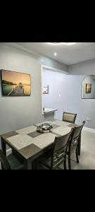 a dining room with a table and some chairs at Blue Water Villa in Point
