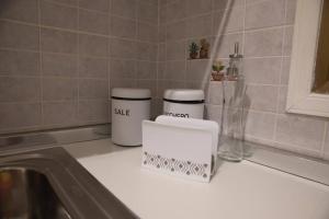 a kitchen counter with two white containers on it at Spalti 33 in Trapani +20 photos