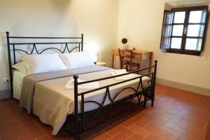 A bed or beds in a room at Podere San Giorgio
