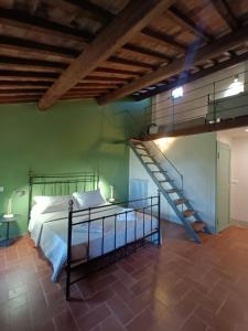 A bed or beds in a room at Podere San Giorgio