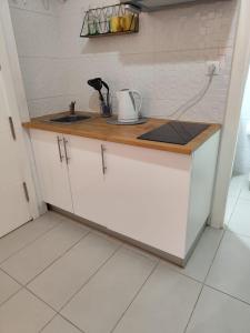 a kitchen with a sink and a counter top at San Nicolas Apartaments in Fuengirola +3 photos