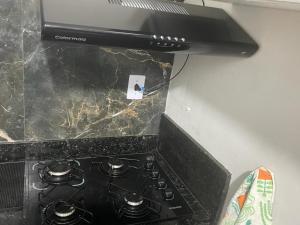 A cozinha ou cozinha compacta de Apartamento na Praia do Forte em Cabo Frio apto N113