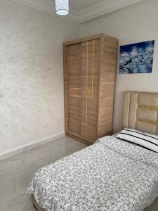 Uma cama ou camas num quarto em Tetouan Relax Apartement