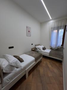 Ένα ή περισσότερα κρεβάτια σε δωμάτιο στο Ninella Apartment