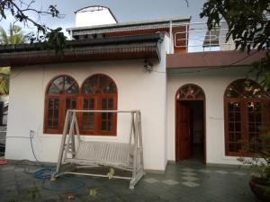 a house with a gate in front of it at DeBee home stay in Kurunegala