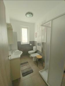 a bathroom with two toilets and a sink at Dimora San Francesco 1 in Campobasso +21 photos