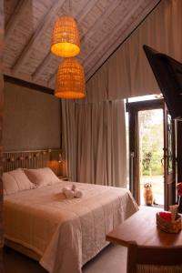 Ένα ή περισσότερα κρεβάτια σε δωμάτιο στο Pousada Villa Del More