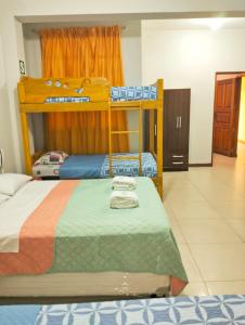 a bedroom with two bunk beds and a room at 100 RV APARTMENTS IQUITOS PERU-Apartamento primer piso con ventana a piscina in Iquitos +5 photos