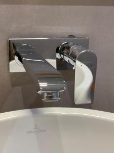 a close up of a toilet water faucet at Villa Vista in Toubab Dialaw