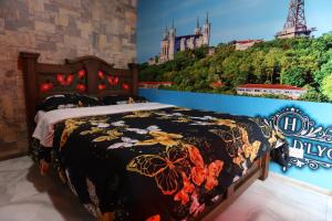 Postel nebo postele na pokoji v ubytování Hôtel d’lyon