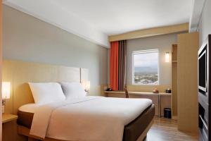 Letto o letti in una camera di Ibis Padang