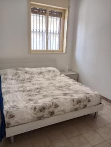 A bed or beds in a room at Alexia