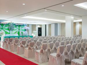 a room with rows of chairs and a red carpet at Amaris Hotel Kupang in Kupang +18 photos
