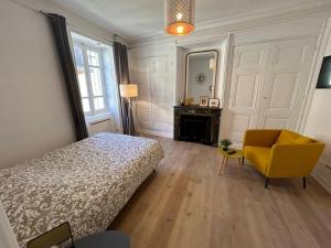 Postel nebo postele na pokoji v ubytování Studio Cosy Charme Ancien