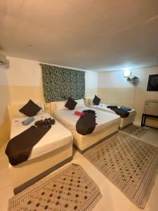 Postel nebo postele na pokoji v ubytování Varadero Zanzibar Hotel