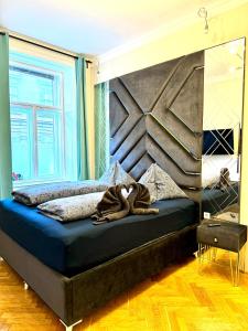 Posteľ alebo postele v izbe v ubytovaní Belvedere Apartment