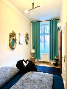 Posteľ alebo postele v izbe v ubytovaní Belvedere Apartment