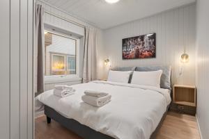 Postel nebo postele na pokoji v ubytování ARCTIC HOMES - Nordic Oasis + 6 fotografií