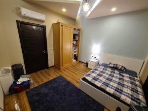 a small bedroom with a bed and a closet at 2 spacious bedrooms apartment in Cairo